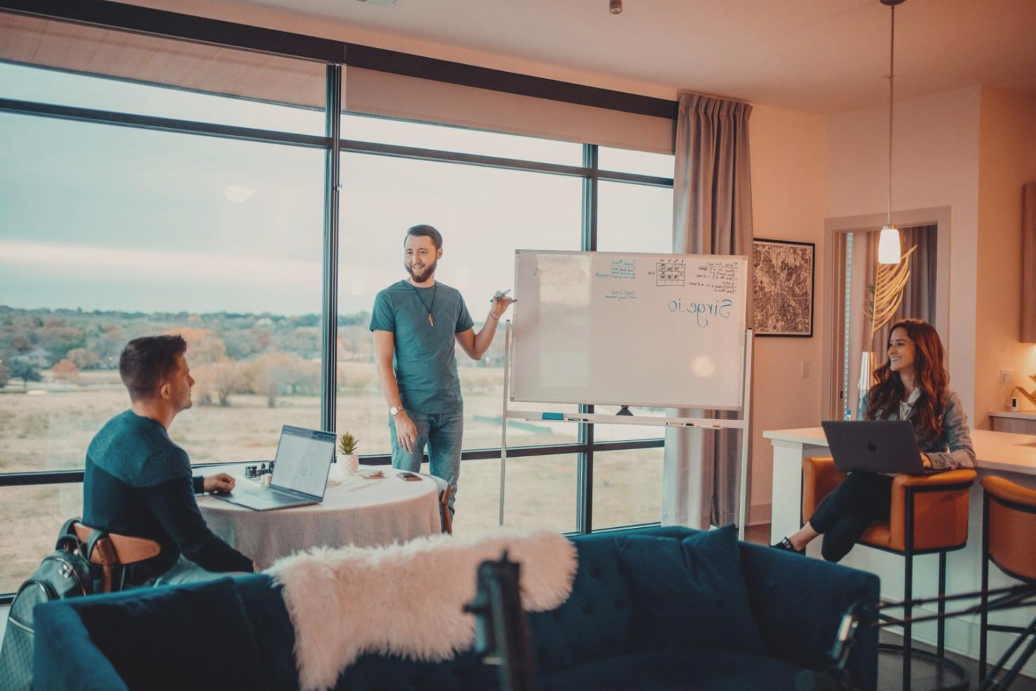 Person reviewing weekly budget planning with calculator and financial documents